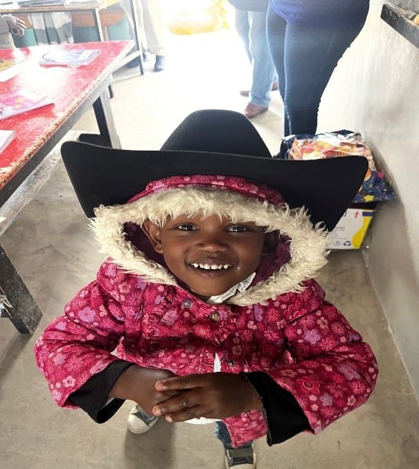 Children around the world wearing Bert's hat.
